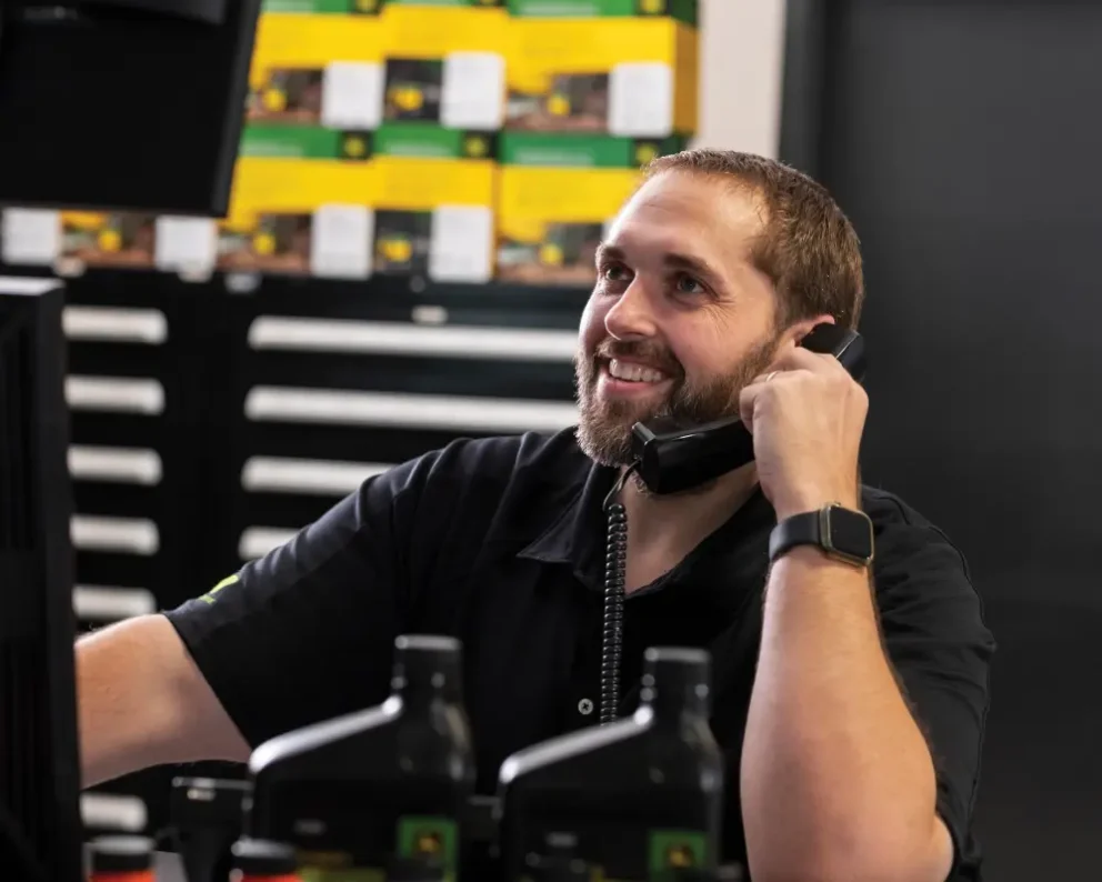 Employee taking a phone call in the parts department