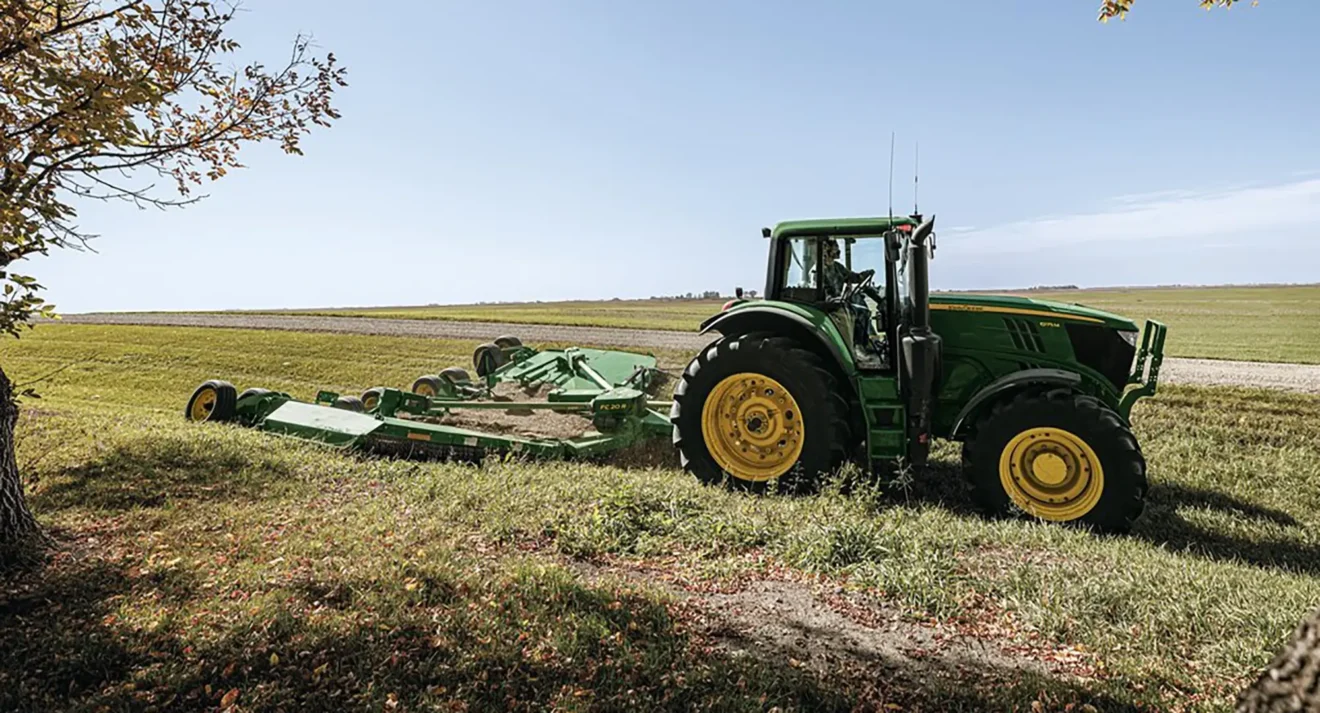 Used Equipment Tractor mowing ditch