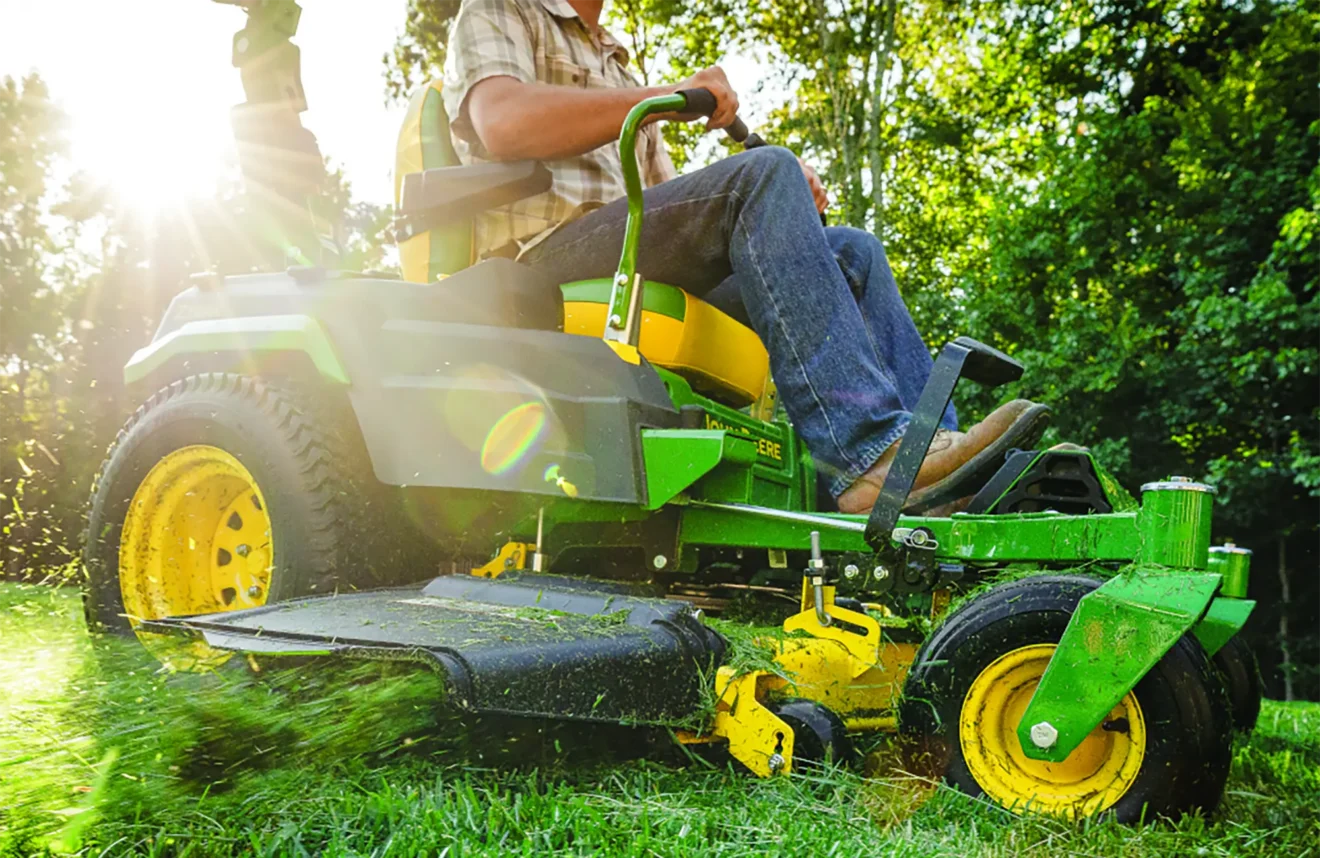 Zero-turn mower in action cutting grass